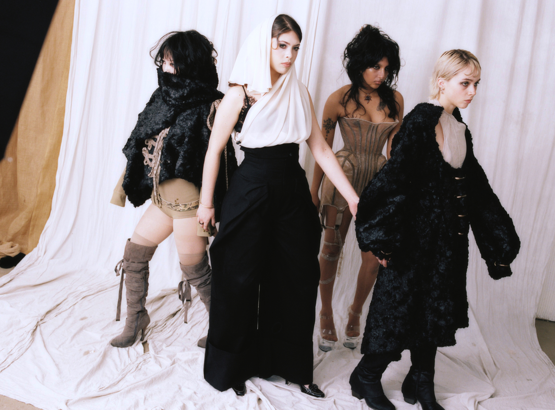 INDOCILE four-look editorial frame with the full cast in studio