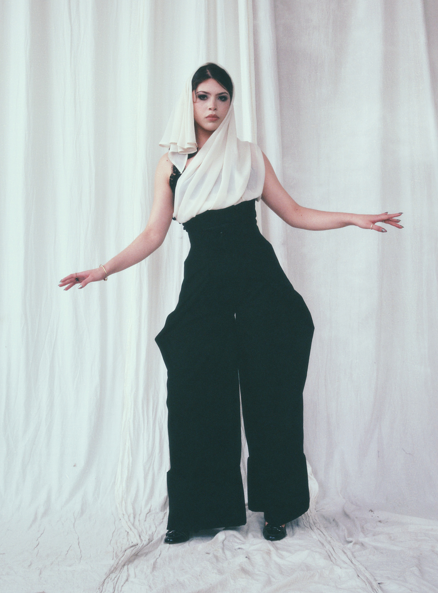 Insurgent Veiled full-length study with extended arms and draped ivory hood