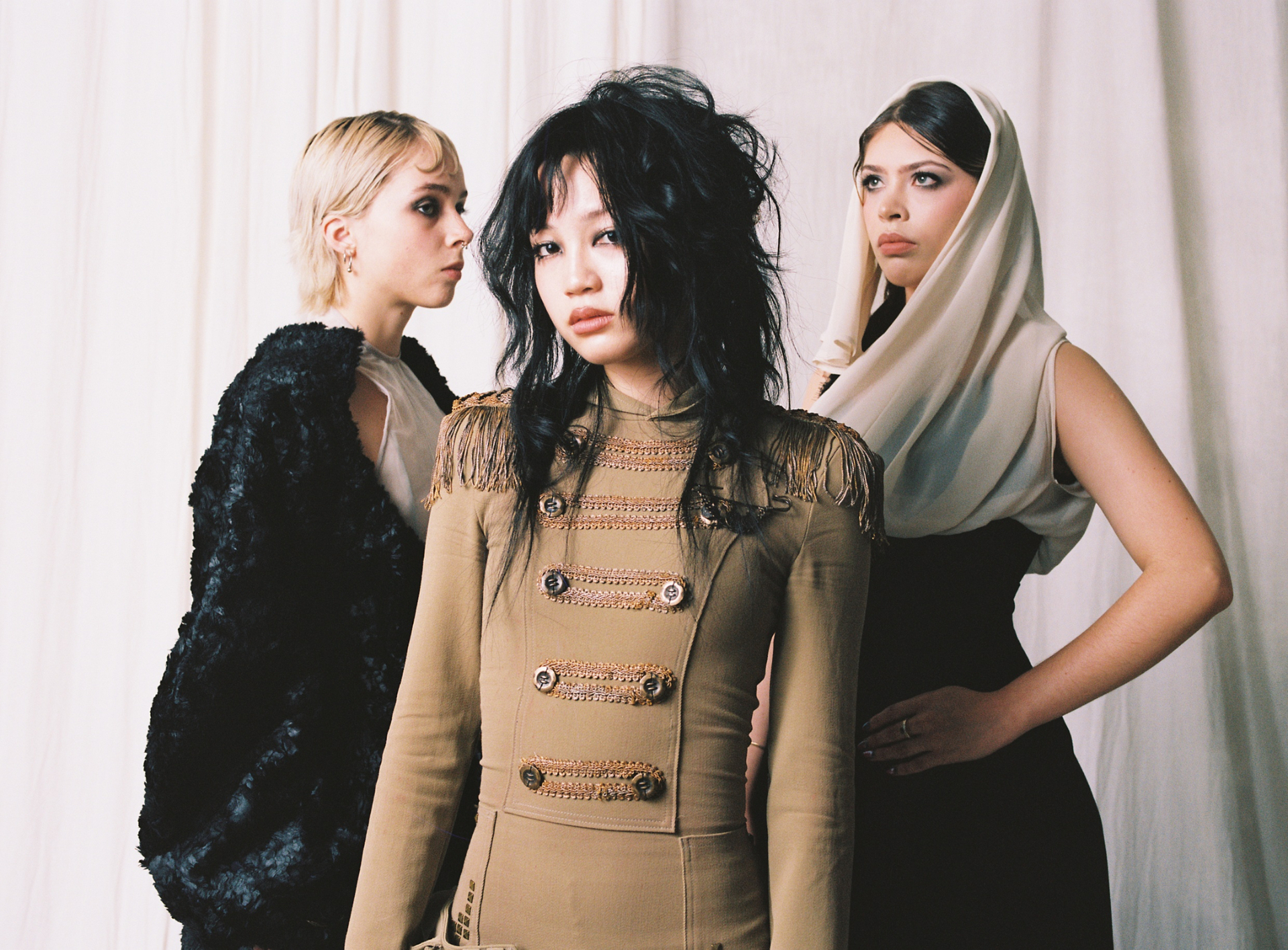 Group portrait featuring Divya Gupta, Lee Lynshue and Monáe Simpson looks